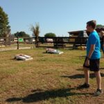 Ethan Playing Cornhole at Shuckles